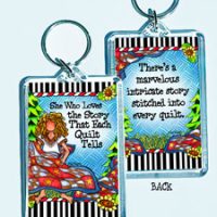 She Who Loves the Story That Each Quilt Tells – 3″ x 2″ Acrylic (double-sided) Key Chain (Quilt / Fabric)